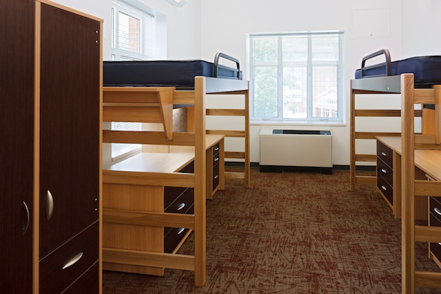 Dorm room-style accommodations include lofted beds.